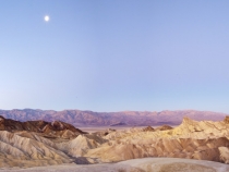 Moonlight over the Panamint Range and Golden Canyon at sunrise from Zabriskie Point