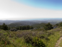 Panoramic of Drake's Bay with Kristen on the way up the trail