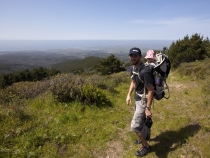 Sam and Lilia on the trail with Drake's Bay in the distance