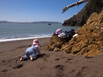 Lilia crawling on the beach at Kirby Cove