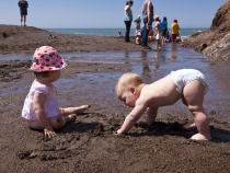 Lilia and Samuel enjoying the sand