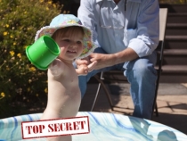 Lilia in the pool with Grandpa Greg