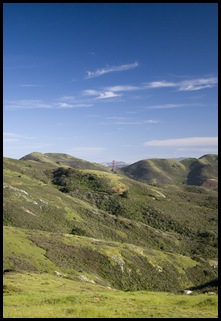 The Golden Gate Bridge peeking through the Marin Headlands