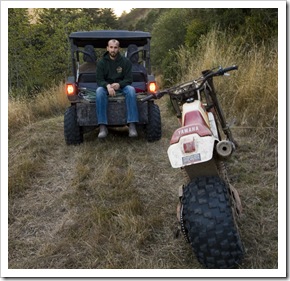 Sam on the back of the four-wheeler after running out of fuel...