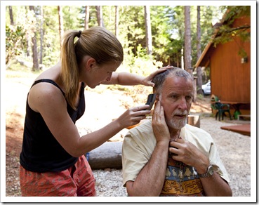 Greg getting a cut at Lisa's barber shop