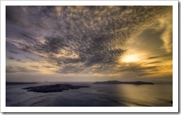 Sunset over Nea Kameni and Thirasia: the quiet before the storm