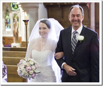 Bob proud with his daughter walking down the aisle