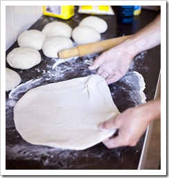 Chris working on the dough for a pizza bonanza