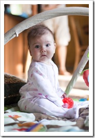 Lilia sitting confidently by herself