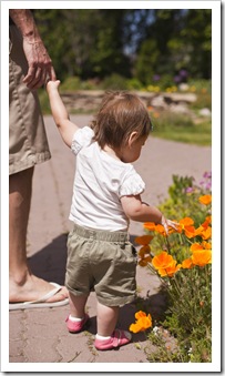 Sam and Lilia admiring the flowers in Gibson Park in Great Falls