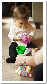 Enjoying the ribbon more than the present