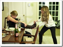 Annie helping Lisa get off her new boots