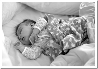 Lilia asleep in Mum and Dad's bed