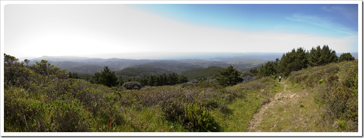 Panoramic of Drake's Bay with Kristen on the way up the trail