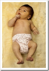 Lilia on Grandma Jenni's sheepskin
