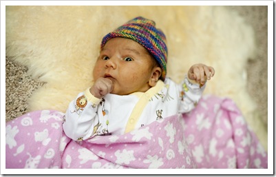 Lilia on Grandma Jenni's sheepskin