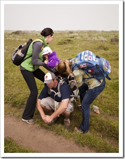 Teamwork getting Gianna into the backpack