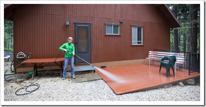 Lisa power washing the rear deck