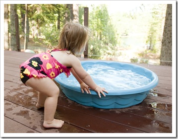 Lilia enjoying her pool on the deck at the cabin