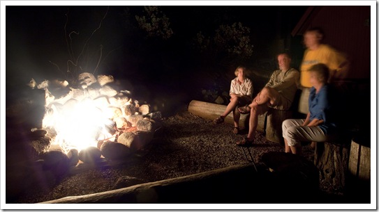 Carol, Greg, Jenni and Steve around the fire at the cabin