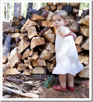 Helping Dad stack the wood pile