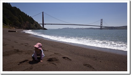 Lilia on the beach in Kirby Cove with the Golden Gate Bridge in the background